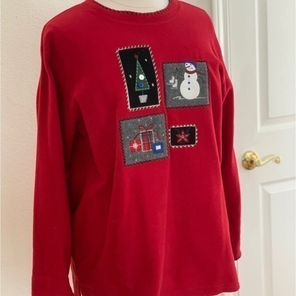 Festive red fleece. Appliqué snowman, tree, star & presents. Blanket stitch trim